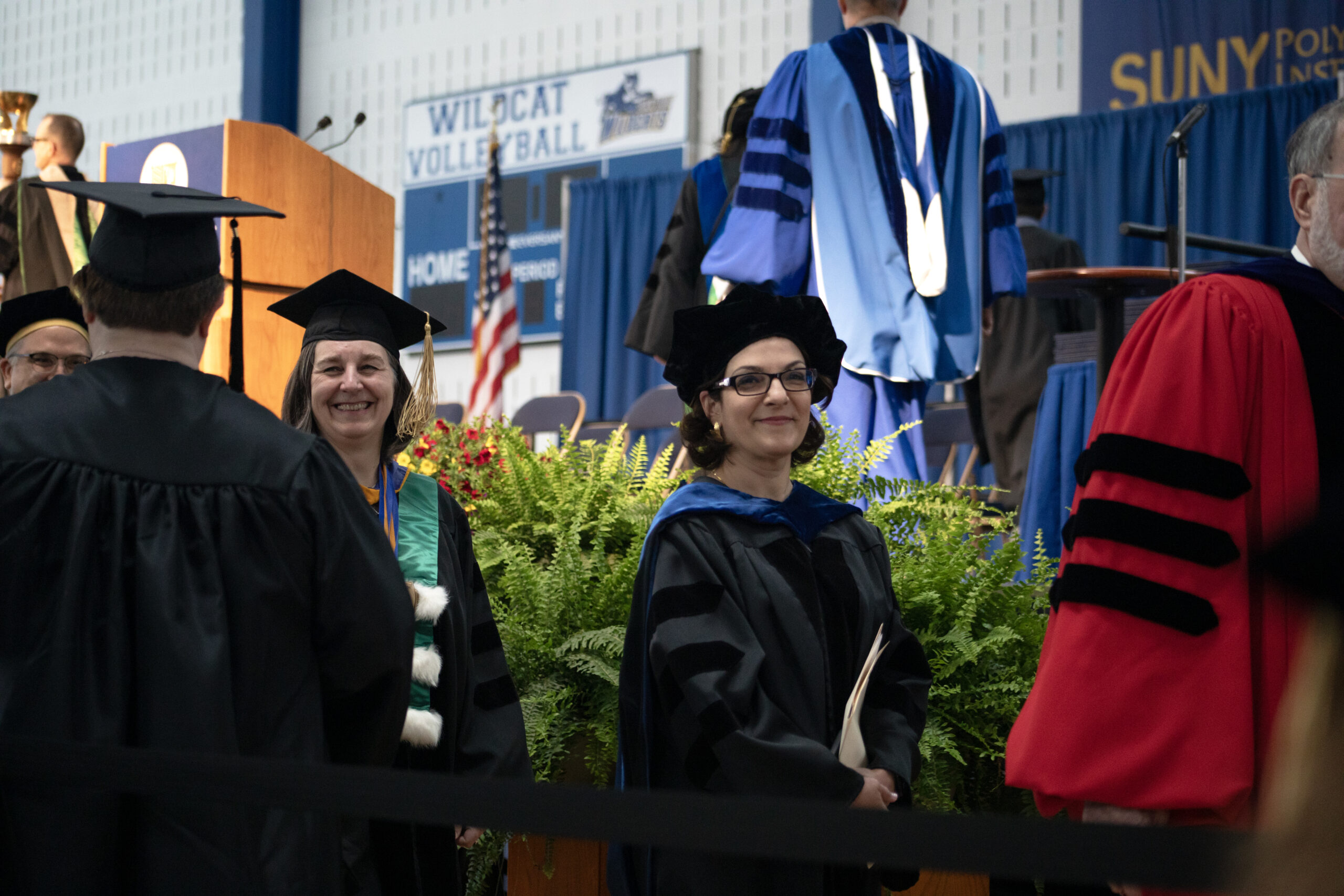 Dr. Maria Kontaridis walking on a stage at SUNY Poly