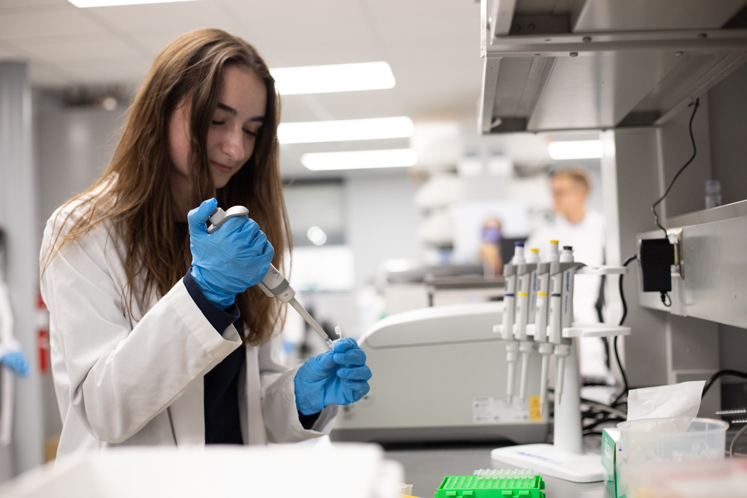 Scientist pipetting