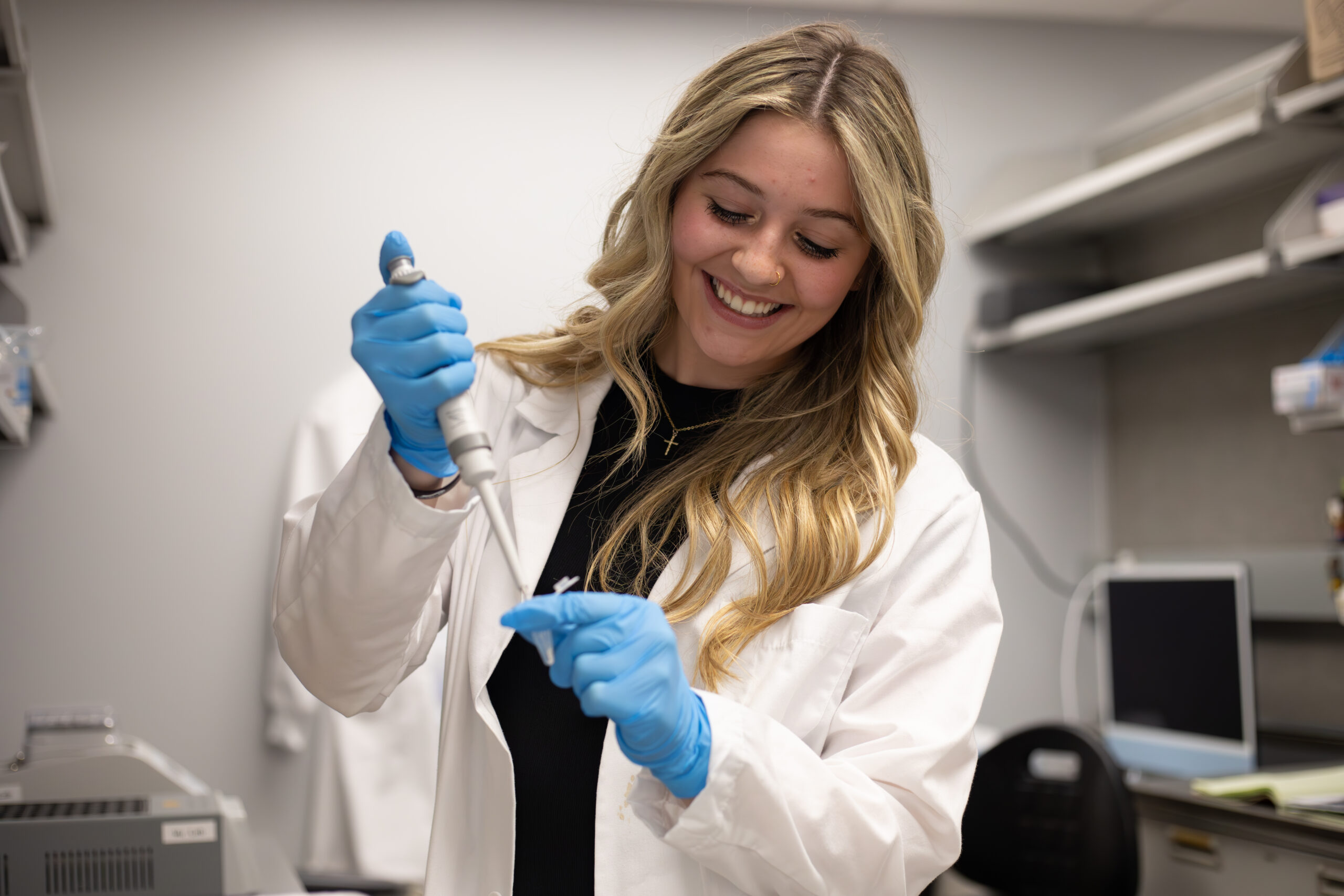 Scientist pipetting