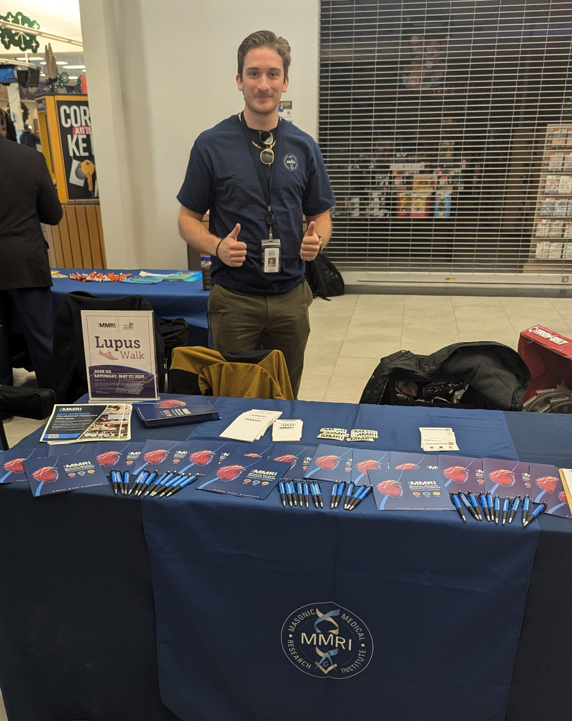 Person standing behind expo table