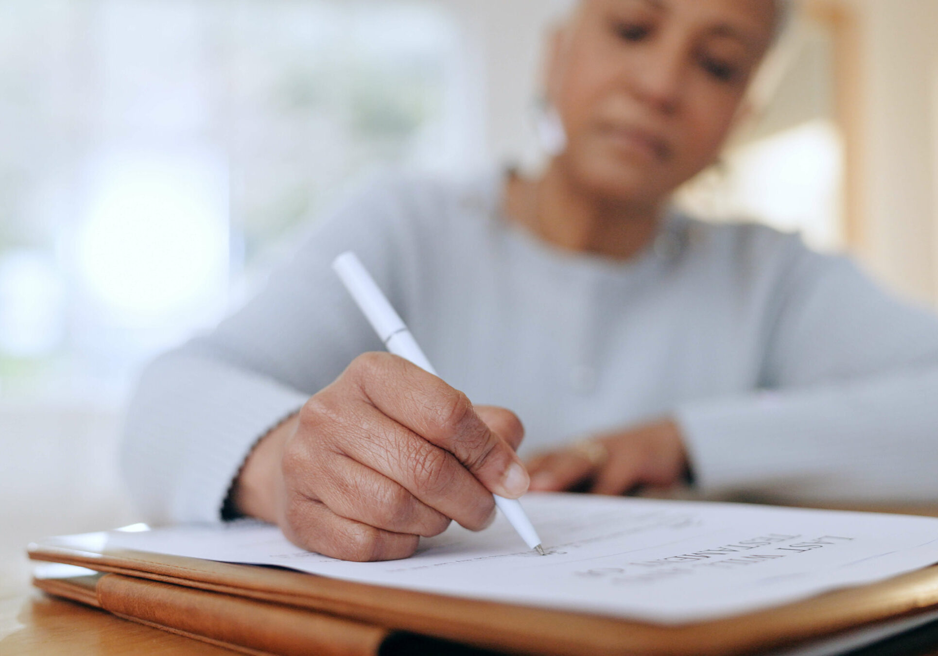 Women signing papers